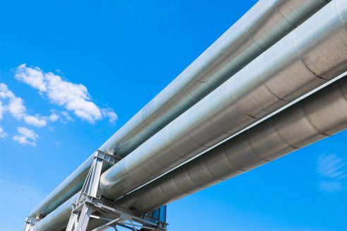 Pipeline,against,a,blue,sky,background,view,from,below.